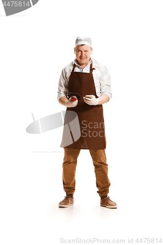 Image of Smiling butcher posing with a cleaver isolated on white background