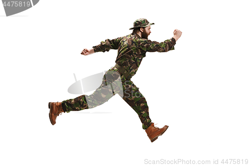 Image of Young army soldier wearing camouflage uniform isolated on white