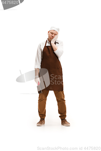 Image of Bored butcher posing with a cleaver isolated on white background