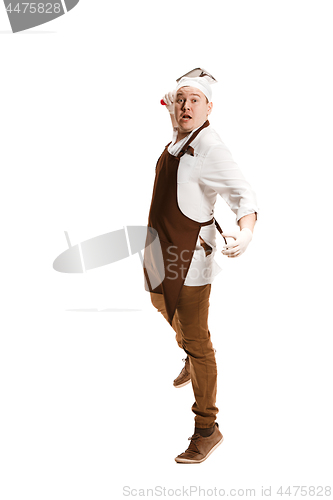 Image of Angry aggressive butcher posing with a cleaver isolated on white background