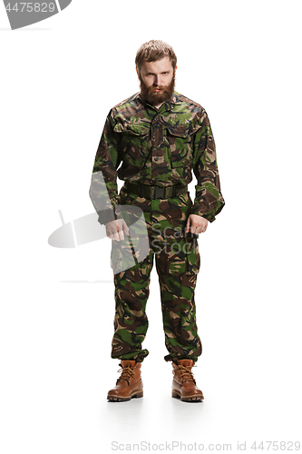 Image of Young army soldier wearing camouflage uniform isolated on white