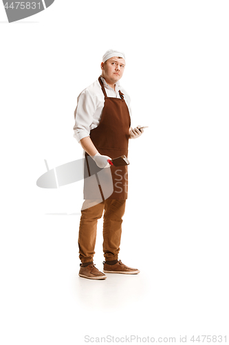 Image of Serious butcher posing with a cleaver isolated on white background