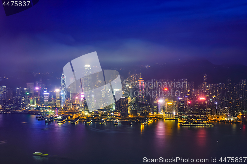 Image of Aerial view of illuminated Hong Kong skyline. Hong Kong, China