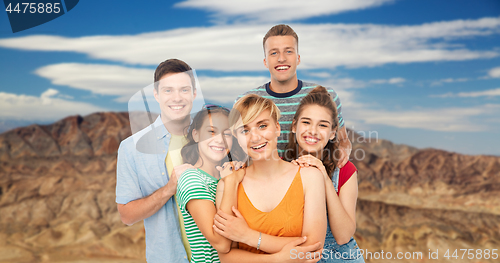 Image of happy friends over grand canyon background