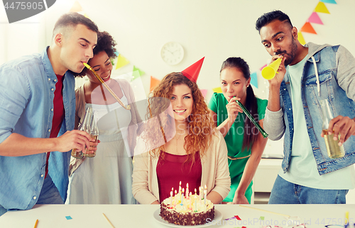 Image of happy coworkers with cake at office birthday party