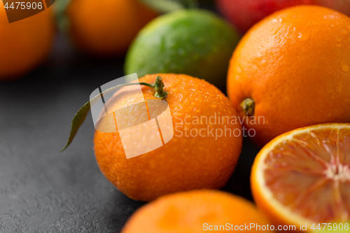 Image of close up of citrus fruits on stone table