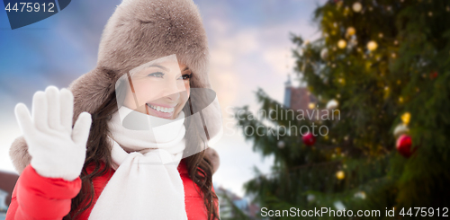 Image of happy woman over christmas tree in tallinn