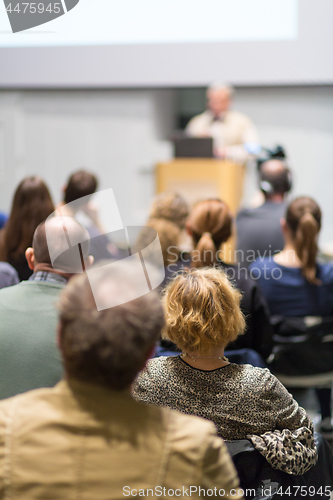 Image of Man giving presentation in lecture hall at university.