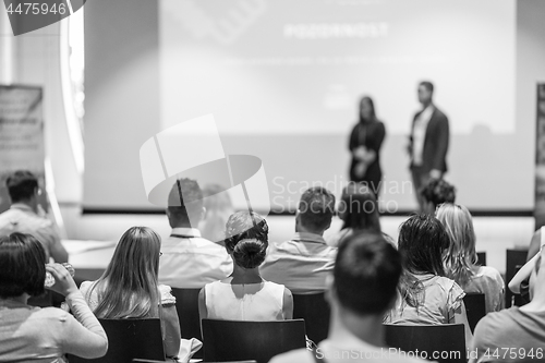 Image of Business speakers giving a talk at business conference event.