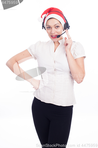 Image of Pretty phone operator in Santa hat isolated over white