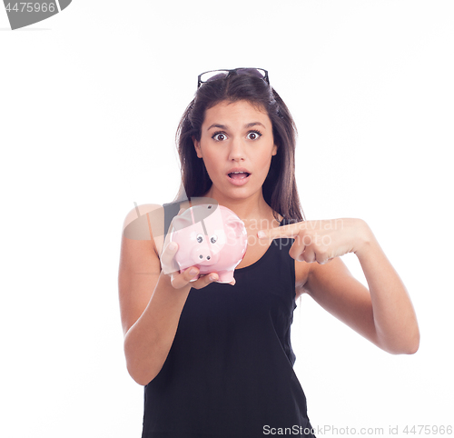 Image of Young woman hold a piggy bank