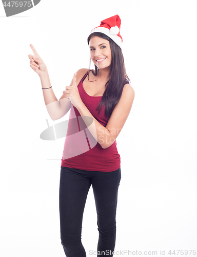 Image of Happy christmas woman pointing