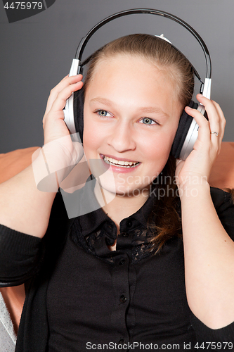 Image of happy girl listening to music