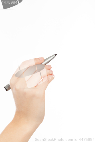 Image of woman\'s hand with a pen or marker