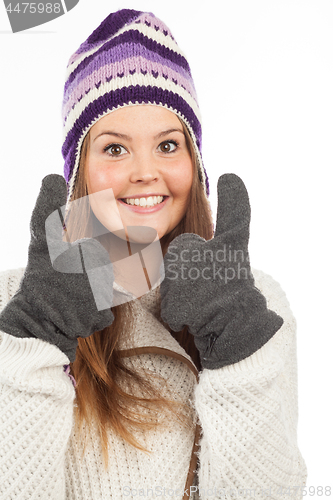 Image of Face of pretty woman with gloves and knitted winter cap  with smile