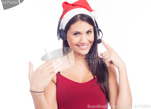 Image of Christmas headset woman from telemarketing call center wearing red santa hat talking smiling isolated on white background.