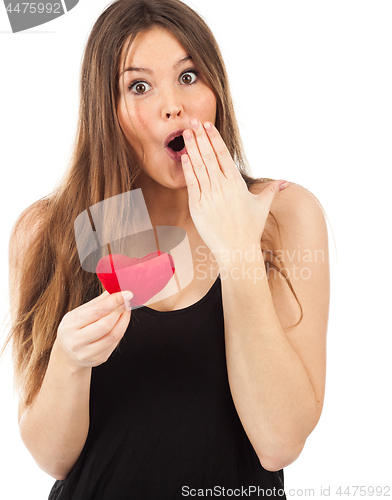 Image of young woman in love with a heart in hand