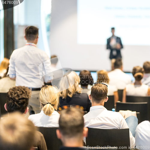 Image of Business speaker giving a talk at business conference event.