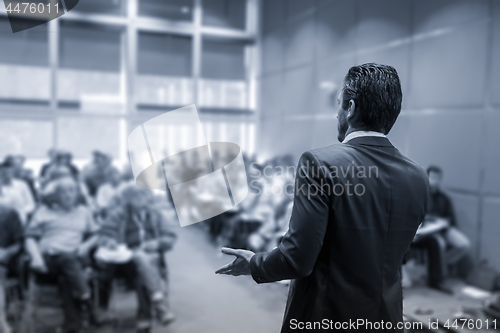 Image of Speaker Giving a Talk at Business Meeting.