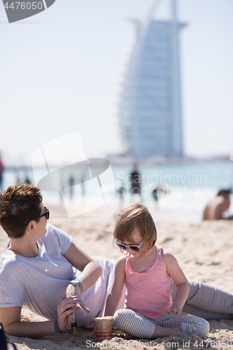 Image of Mom and daughter on the beach