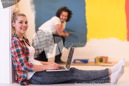 Image of Happy couple doing home renovations