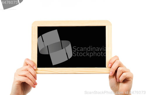 Image of woman\'s hands holding a blackboard publicity
