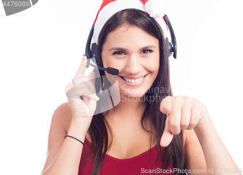 Image of Pretty phone operator in Santa hat isolated over white