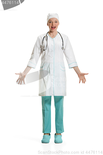 Image of Beautiful young woman in white coat posing at studio. Full length studio shot isolated on white.