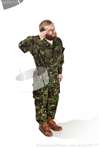 Image of Young army soldier wearing camouflage uniform isolated on white