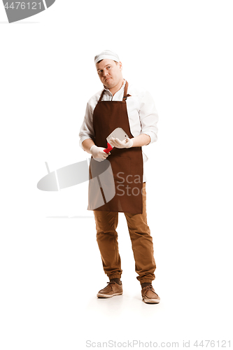 Image of Smiling butcher posing with a cleaver isolated on white background