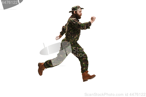 Image of Young army soldier wearing camouflage uniform isolated on white