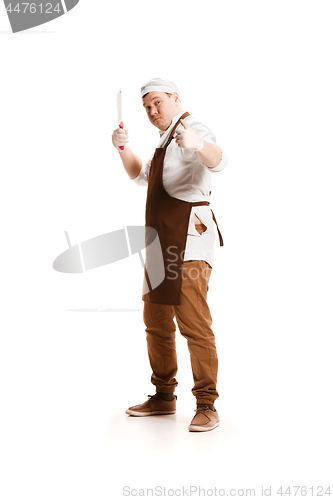 Image of Smiling butcher posing with a cleaver isolated on white background