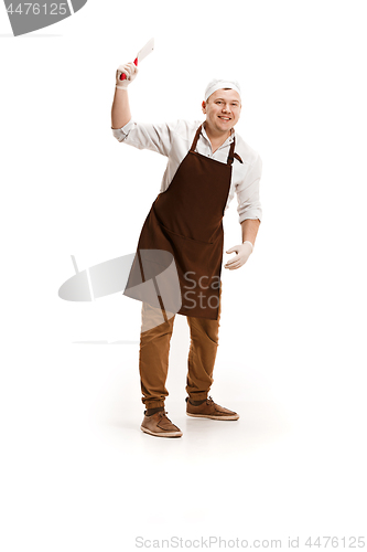 Image of Smiling butcher posing with a cleaver isolated on white background