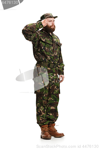 Image of Young army soldier wearing camouflage uniform isolated on white