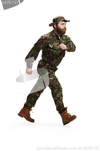 Image of Young army soldier wearing camouflage uniform isolated on white