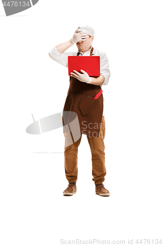 Image of Sorry butcher posing with a laptop isolated on white background