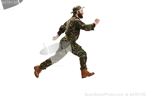 Image of Young army soldier wearing camouflage uniform isolated on white