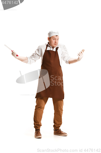 Image of Smiling butcher posing with a cleaver isolated on white background