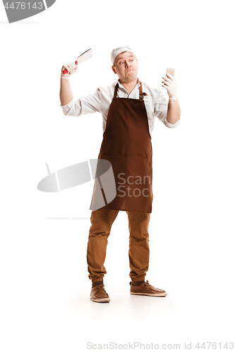 Image of Smiling butcher posing with a cleaver isolated on white background