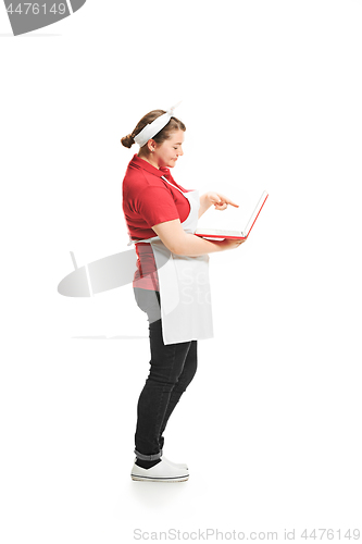 Image of Portrait of cute smiling woman with laptop in her hands in the studio, isolated on white background