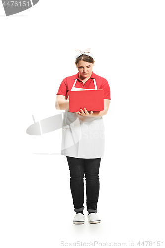 Image of Portrait of cute smiling woman with laptop in her hands in the studio, isolated on white background