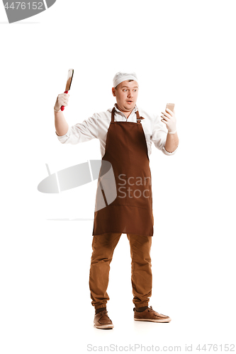 Image of Smiling butcher posing with a cleaver isolated on white background