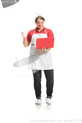 Image of Portrait of cute smiling woman with laptop in her hands in the studio, isolated on white background