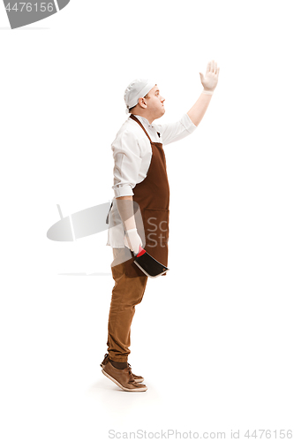 Image of Smiling butcher posing with a cleaver isolated on white background