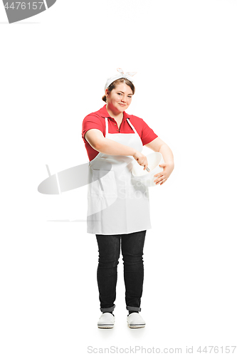 Image of Portrait of cute smiling woman with bowl in her hands in the studio, isolated on white background