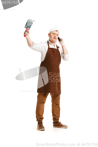 Image of Smiling butcher posing with a cleaver isolated on white background