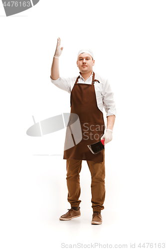 Image of Smiling butcher posing with a cleaver isolated on white background