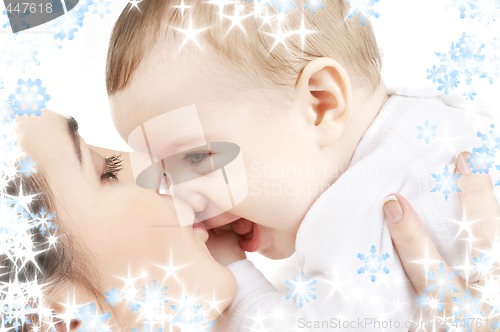 Image of happy mother kissing baby boy