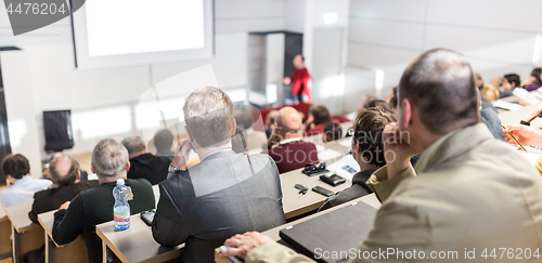 Image of Business speaker giving a talk at business conference event.