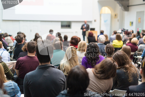 Image of Man giving presentation in lecture hall at university.